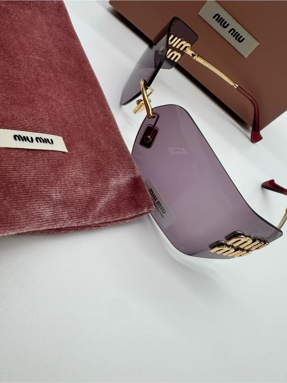 Miu Miu Purple Rimless Sunglasses with Gold Accents